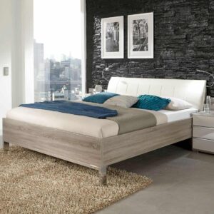 Minimalistická posteľ LOFT – čalúnené čelo vo farbe magnólia, rám v dekore dekor dub truflový