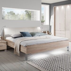 Minimalistická posteľ LOFT s nízkym rámom v dekore dub pílený a čalúneným čelom vo farbe magnólia