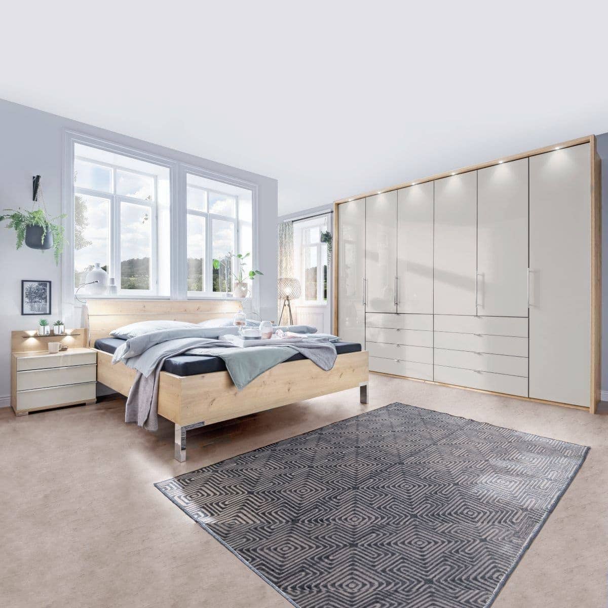 Spálňa LOFT s posteľou v dekore dub bianco a funkčnou skriňou so sklom kamienkovo sivá